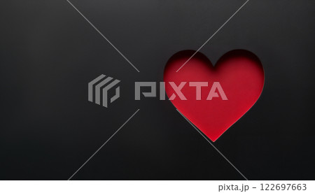 abstract dark background for Valentine day holiday, red heart shape on a black backdrop with copy space 122697663