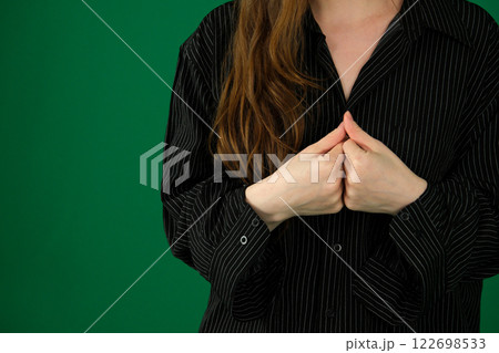 girl Two fists next to each other. expression of emotions with hands unrecognizable people hands palms fingers close-up. green background chromakey feelings girl Two fists next to each other. expression of emotions with hands unrecognizable people hands palms fingers close-up. green background chromakey feelings 122698533