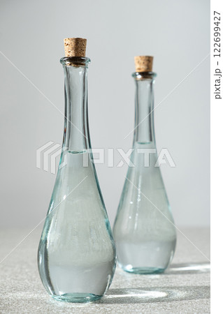 Classic table vinegar in a narrow-spout vinegar bottles with a corks Classic table vinegar in a narrow-spout vinegar bottles with a corks 122699427