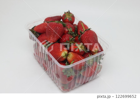 Punnet of strawberries in plastic containers for sale at a local market. Punnet of strawberries in plastic containers for sale at a local market. 122699652