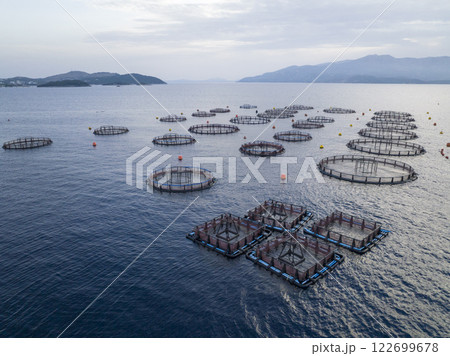 Aerial shot of Aquaculture sea fish Floating farming cages, offshore marine seafood industry in Adriatic Sea. Salmon. 122699678