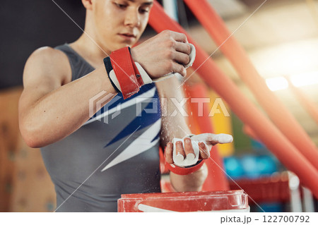 Gym chalk, gymnast man and sports workout goal, fitness or exercise to train. Health training, practicing and fit sport athlete with magnesium carbonate dust for fight, strength or wellness. 122700792