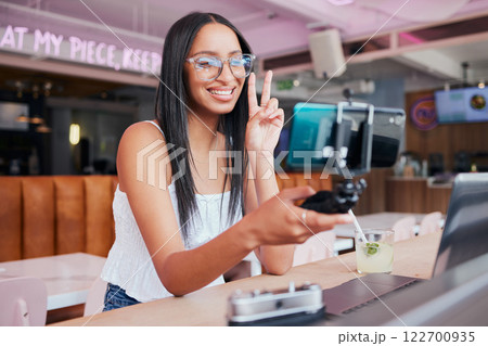 Social media influencer, phone and selfie stick for internet, web and followers with peace sign. Creative online communication with digital mobile tech for startup travel video blog website or app 122700935