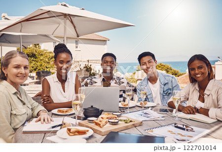 Collaboration, food and meeting with a team eating and working at a restaurant for a client lunch. Teamwork, solidarity and diversity with a group of colleagues discussing and planning for growth 122701014