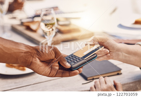 Restaurant customer payment with credit card on machine or digital tech for contactless and secure payment while fine dining. Food business manager or waiter hands using 5g to tap or scan a bank card 122701059