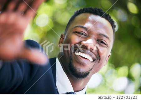 Portrait smile of a happy businessman in the city during summer smiling and looking happy on a sunny day. African american male entrepreneur with happiness on his face because of success in work 122701223