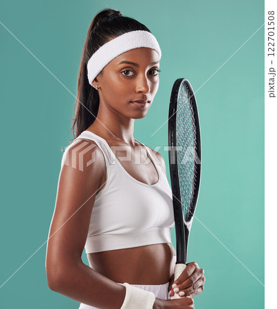 Tennis player, athlete or sports person training for game or match. Fitness, confident and athletic lady posing with a racket for competition. Portrait of black woman female, exercise and workout. 122701508