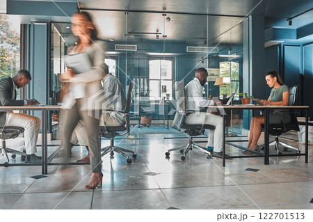 Work process of busy corporate team of business people working at startup marketing company, planning email on laptop and sitting at desk in office. Blur of employees, workers and businesspeople 122701513