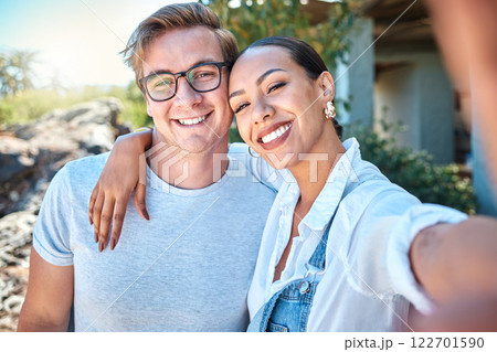 Selfie of interracial couple in love, smile and romantic date with care, bond and relax in summer outside. Portrait of happy boyfriend and girlfriend on holiday with special vacation photo together 122701590