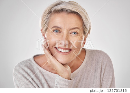 Face of beauty, mature woman with care and wellness in studio. Smile with natural makeup, anti aging dermatology and skincare or health. Portrait of a happy and relaxed lady with a positive mindset Face of beauty, mature woman with care and wellness in studio. Smile with natural makeup, anti aging dermatology and skincare or health. Portrait of a happy and relaxed lady with a positive mindset 122701816