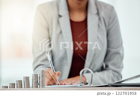 Bank, coins and hands writing in tax files for financial year or consulting at work desk. Economy, money and accountant working on corporate documents and administration for management. Bank, coins and hands writing in tax files for financial year or consulting at work desk. Economy, money and accountant working on corporate documents and administration for management. 122701958