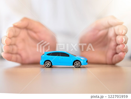 Hands, car and insurance with a business employee covering transport with her hands in her company office. Finance, saving and transportation with a broker offering to secure your vehicle at work Hands, car and insurance with a business employee covering transport with her hands in her company office. Finance, saving and transportation with a broker offering to secure your vehicle at work 122701959