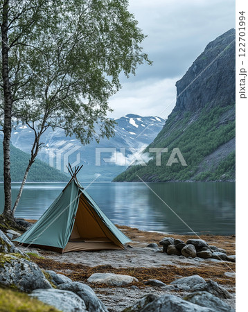 Cozy tent on a serene beach by the fjord in Norway's lapland 122701994