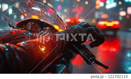 Hand on clutch lever in vibrant city night lights during a ride Hand on clutch lever in vibrant city night lights during a ride 122702110
