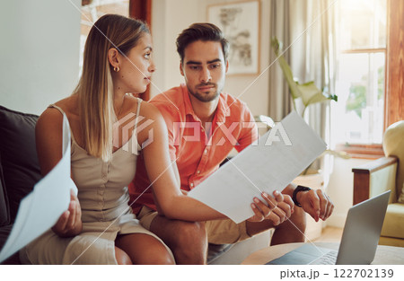 Unhappy, stressed and upset couple paying bills or debt online on with a laptop at home getting angry, planning budget. Young man and woman having a dispute over finance, savings and increasing tax Unhappy, stressed and upset couple paying bills or debt online on with a laptop at home getting angry, planning budget. Young man and woman having a dispute over finance, savings and increasing tax 122702139