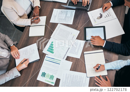 Meeting, briefing and marketing strategy discussion of business people planning company growth using data. Overhead of corporate professionals or management talking and discussing graphs and charts Meeting, briefing and marketing strategy discussion of business people planning company growth using data. Overhead of corporate professionals or management talking and discussing graphs and charts 122702178