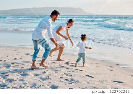Happy family, beach or toddler playing with parents on ocean coast for summer vacation, bonding or holiday. Mom, dad and little girl running with playful guardians for fun weekend or childhood by sea 122702232