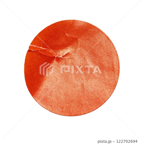 Blank orange round crumpled paper promotion sticker label cutout isolated on a white background 122702694