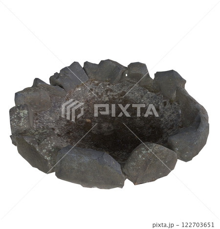 Rustic stone fire pit made from large rocks in outdoor setting 122703651