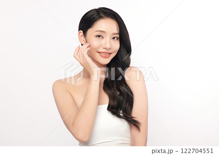 Beautiful young asian woman with clean fresh skin on white background, Face care, Facial treatment, Cosmetology, beauty and spa, Asian women portrait. Beautiful young asian woman with clean fresh skin on white background, Face care, Facial treatment, Cosmetology, beauty and spa, Asian women portrait. 122704551