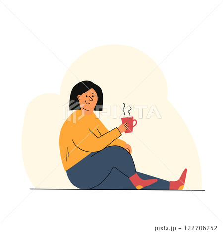 Cozy Woman with a Cup of Hot Tea or Coffee 122706252