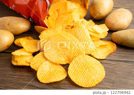 Potato chips , delicious BBQ seasoning spicy for crips, thin slice deep fried snack fast food. 122706982