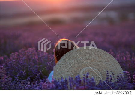 Lavender Fields Sunset Girl: Woman enjoys serene sunset amidst Provence lavender fields, summer, peaceful escape. Lavender Fields Sunset Girl: Woman enjoys serene sunset amidst Provence lavender fields, summer, peaceful escape. 122707554