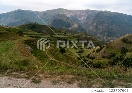 Chokhsky terraces Dagestan. Landscape of mountainous Dagestan with terraced fields and peaks mountains in the distance. Chokhsky terraces Dagestan. Landscape of mountainous Dagestan with terraced fields and peaks mountains in the distance. 122707601