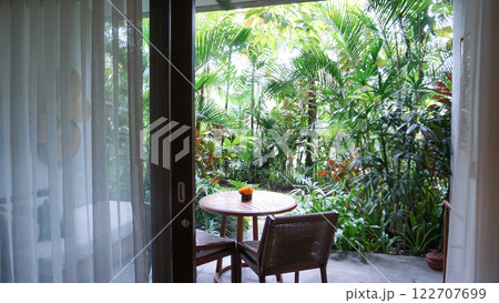 View of the terrace in abstract Ubud resort with summer garden View of the terrace in abstract Ubud resort with summer garden 122707699