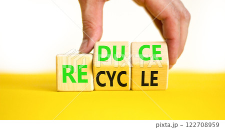 Reduce or recycle symbol. Concept words Reduce Recycle on wooden block. Beautiful yellow table white background. Businessman hand. Business reduce or recycle concept. Copy space. Reduce or recycle symbol. Concept words Reduce Recycle on wooden block. Beautiful yellow table white background. Businessman hand. Business reduce or recycle concept. Copy space. 122708959