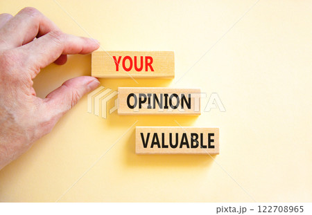 Your opinion valuable symbol. Concept words Your opinion valuable on beautiful wooden blocks. Beautiful white background. Businessman hand. Business your opinion valuable concept. Copy space. 122708965