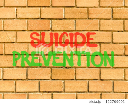 Suicide prevention symbol. Concept words Suicide prevention on beautiful brick wall. Beautiful brick wall background. Psychological and suicide prevention concept. Copy space. Suicide prevention symbol. Concept words Suicide prevention on beautiful brick wall. Beautiful brick wall background. Psychological and suicide prevention concept. Copy space. 122709001