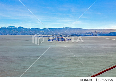 Alcatraz Island in the San Francisco Bay with a distant city skyline Alcatraz Island in the San Francisco Bay with a distant city skyline 122709490