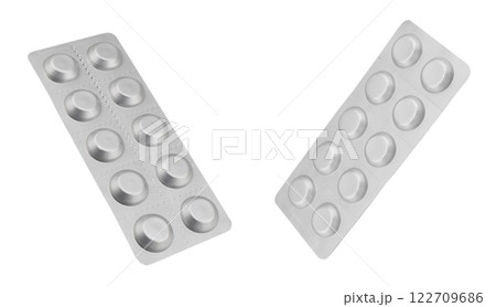 Macro shot pile of tablets pill in silver blister packaging isolated on white background. Aluminium foil blister pack. Pharmacy products. Medicine pills and drugs close up. Pills background 122709686