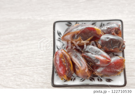 Close up photo of dried dates, selective focus. Close up photo of dried dates, selective focus. 122710530