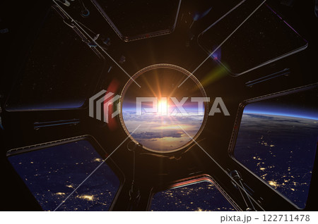 View from porthole of a spaceship to Earth planet. Earth and Sun. 122711478
