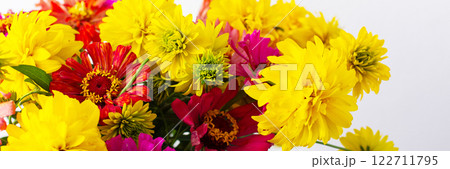 This vibrant bouquet of colorful Zinnia and Rudbeckia Goldquelle flowers brings a cheerful touch to home decor, ideal for a bright and seasonal summer arrangement, banner 122711795