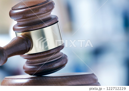 Wooden gavel on judge's desk 122712229