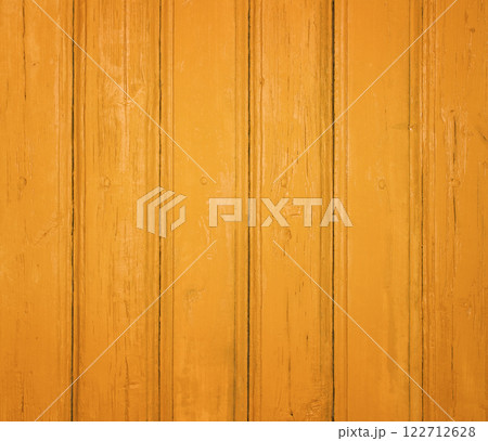 Rustic yellow wooden background with vertical planks and a weathered texture. 122712628