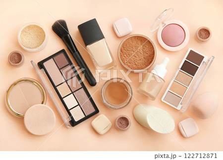 Varieties of face powders and foundations, eye shadows and blushes, make up products, beauty cosmetics with brushes and sponges Varieties of face powders and foundations, eye shadows and blushes, make up products, beauty cosmetics with brushes and sponges 122712871