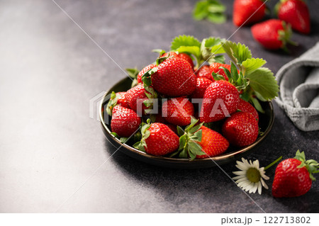 Red ripe strawberries berries. Dark background 122713802