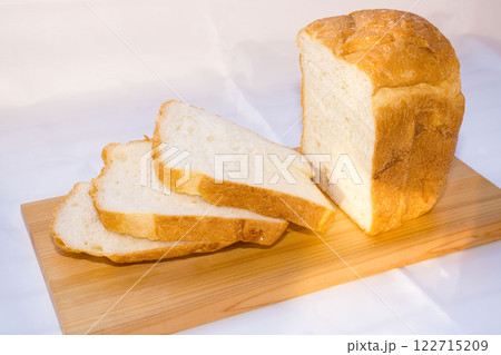 Fresh homemade bread on wooden cutting board. 122715209