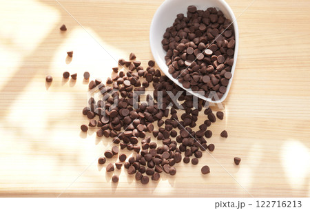 Chocolate chips on wooden board. copy space. Chocolate chips on wooden board. copy space. 122716213