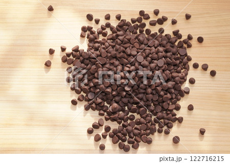 Chocolate chips on wooden board. copy space. Chocolate chips on wooden board. copy space. 122716215