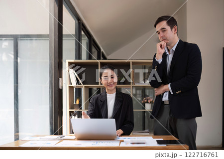 Two businessmen discussing project at the office room Businessman discusses project planning with colleagues in modern workplace while having discussion and advice on financial data report. Two businessmen discussing project at the office room Businessman discusses project planning with colleagues in modern workplace while having discussion and advice on financial data report. 122716761