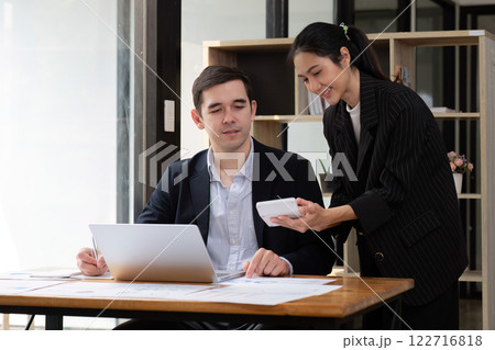Two businessmen discussing project at the office room Businessman discusses project planning with colleagues in modern workplace while having discussion and advice on financial data report. Two businessmen discussing project at the office room Businessman discusses project planning with colleagues in modern workplace while having discussion and advice on financial data report. 122716818