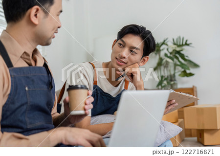 Delivery professionals enjoying a friendly conversation with coffee while collaborating in an inviting workspace Delivery professionals enjoying a friendly conversation with coffee while collaborating in an inviting workspace 122716871