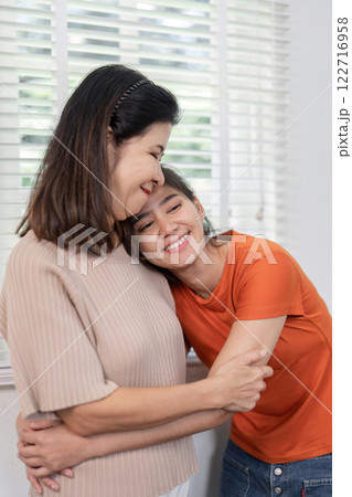 Heartwarming Moment of Mother and Child Embracing on Hug Day Celebrating Love and Connection in a Cozy Home Setting 122716958