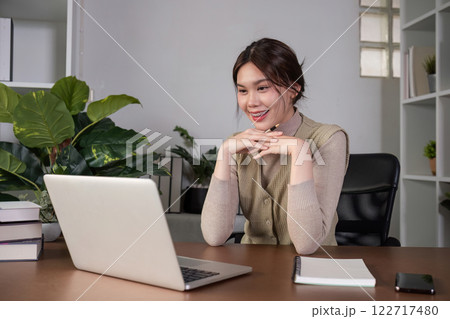 Asian female student studying online Video calls through Zoom about business administration and accounting subjects attentively Asian female student studying online Video calls through Zoom about business administration and accounting subjects attentively 122717480