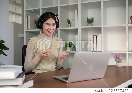 Asian female student studying online Video calls through Zoom about business administration and accounting subjects attentively Asian female student studying online Video calls through Zoom about business administration and accounting subjects attentively 122717835